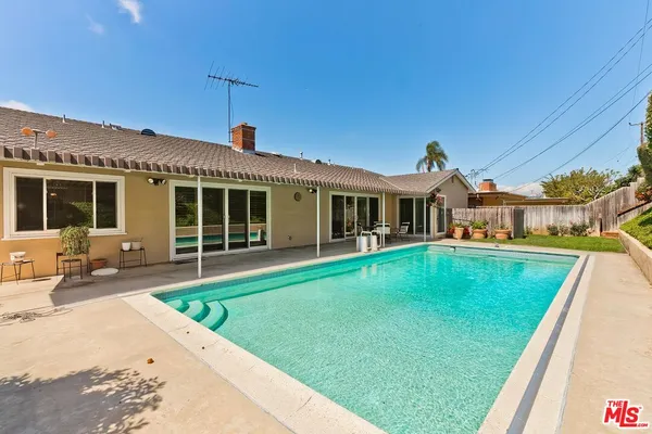 a view of a house with swimming pool