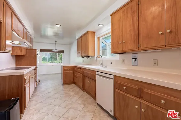a view of storage and utility room with washer and dryer