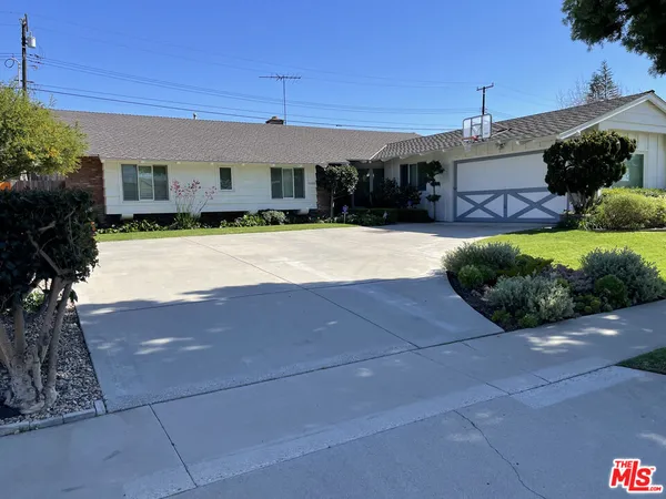 a house view with a garden space