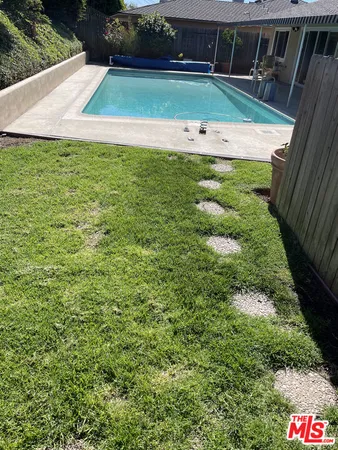 a view of a backyard with plants
