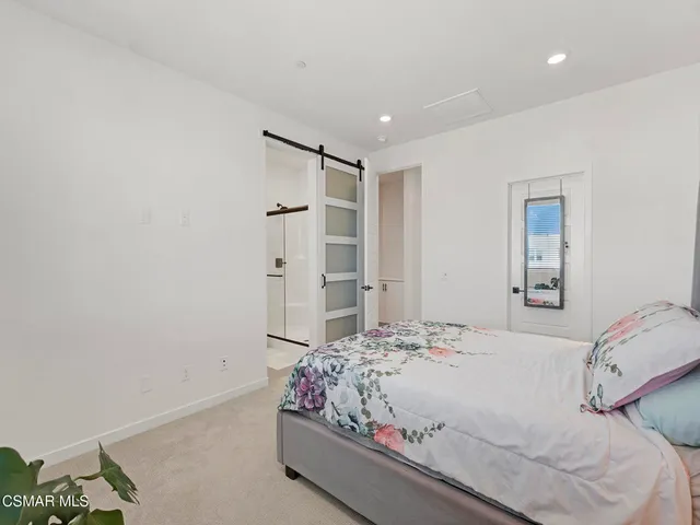 a bathroom with a double vanity sink a mirror and shower