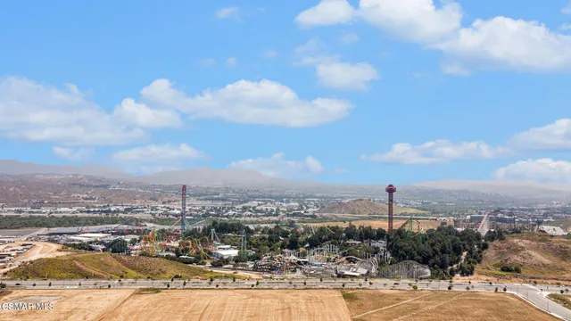 an aerial view of a house with a ocean view
