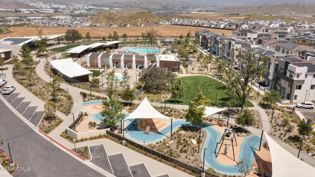 an aerial view of residential house with outdoor space and mountain view