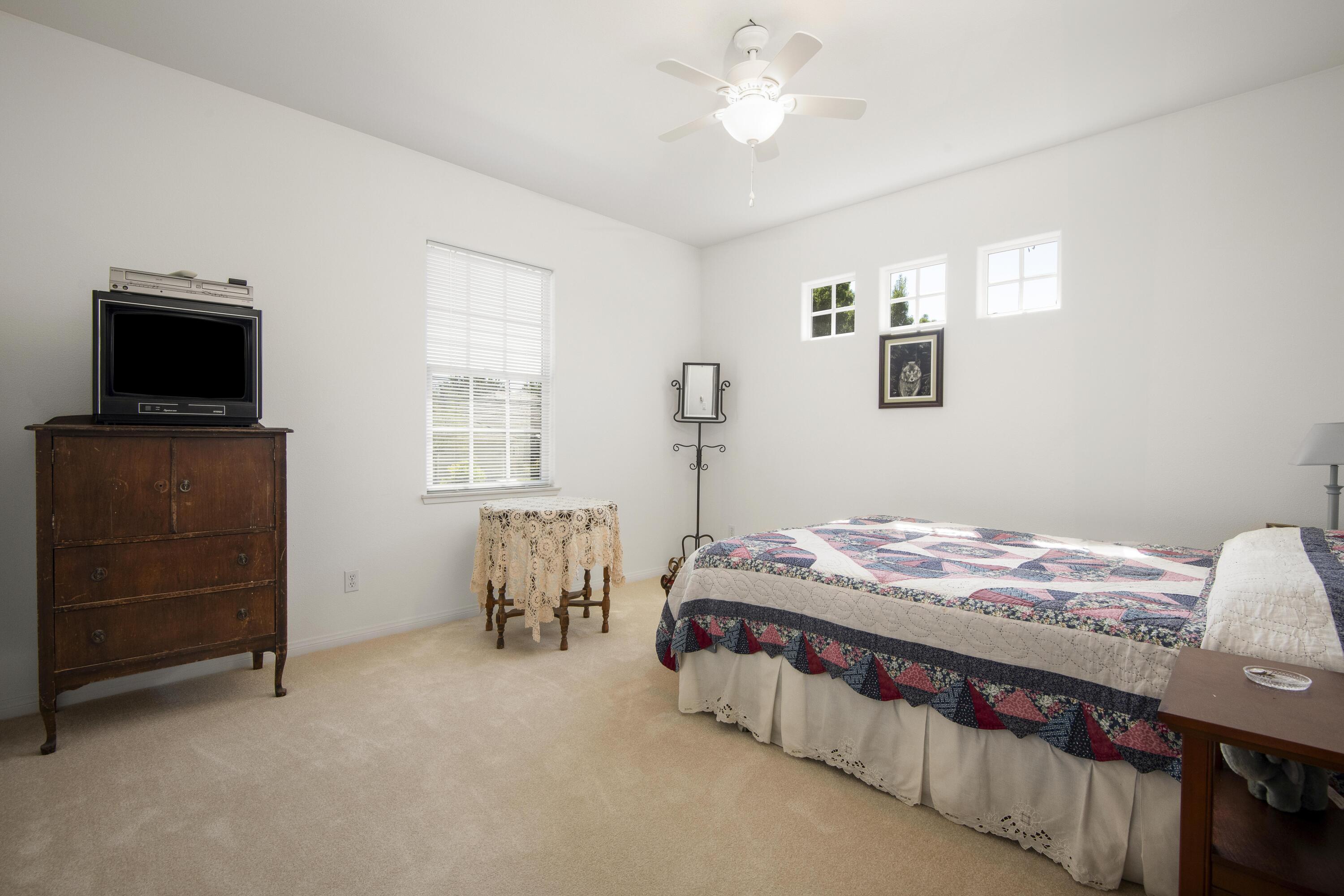 225 Silver Oak Drive Paso Robles, CA 93446 - Photo 12 of 22 a bedroom with a bed and a tv
