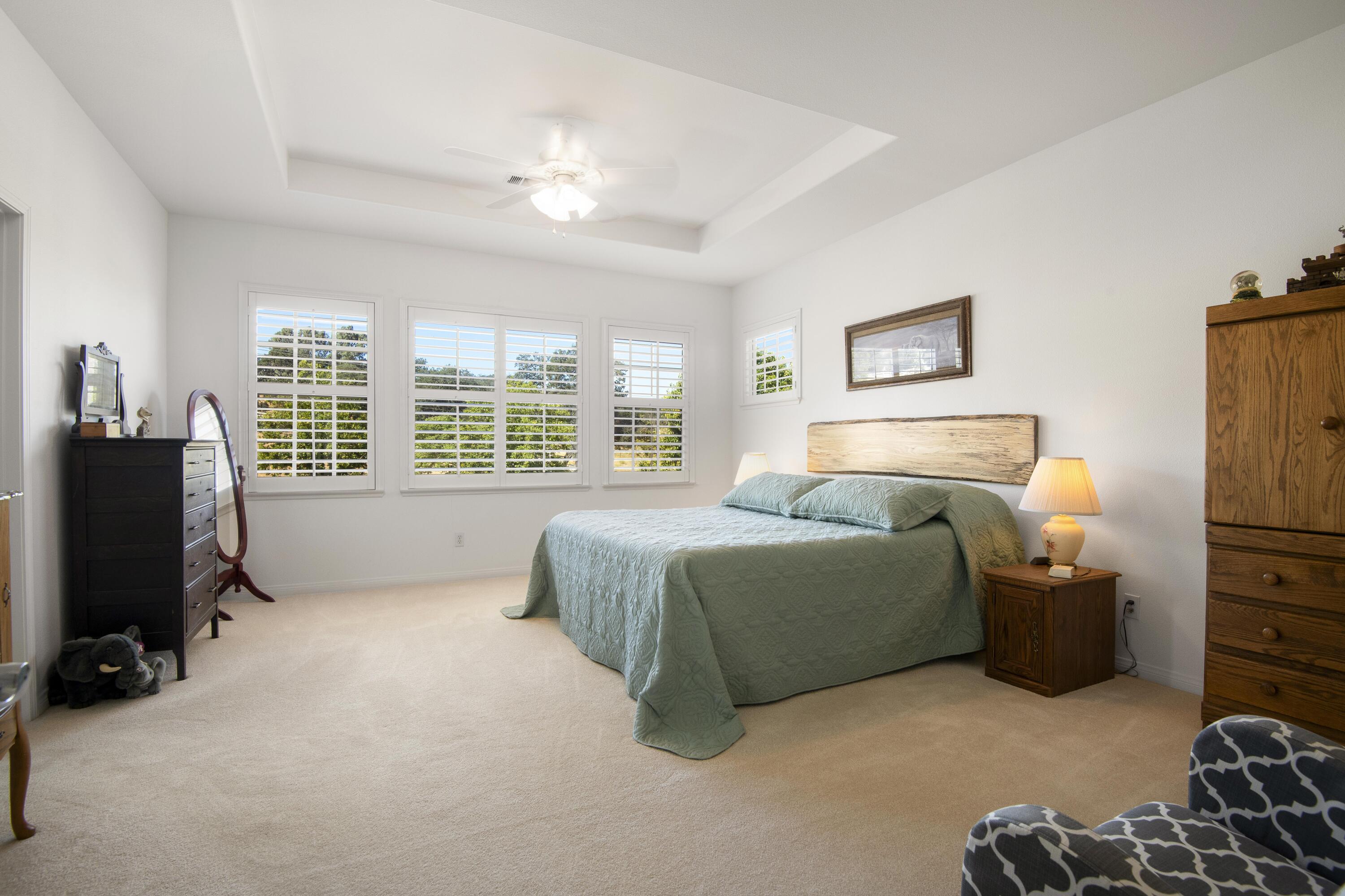 225 Silver Oak Drive Paso Robles, CA 93446 - Photo 13 of 22 a bedroom with a bed and a refrigerator