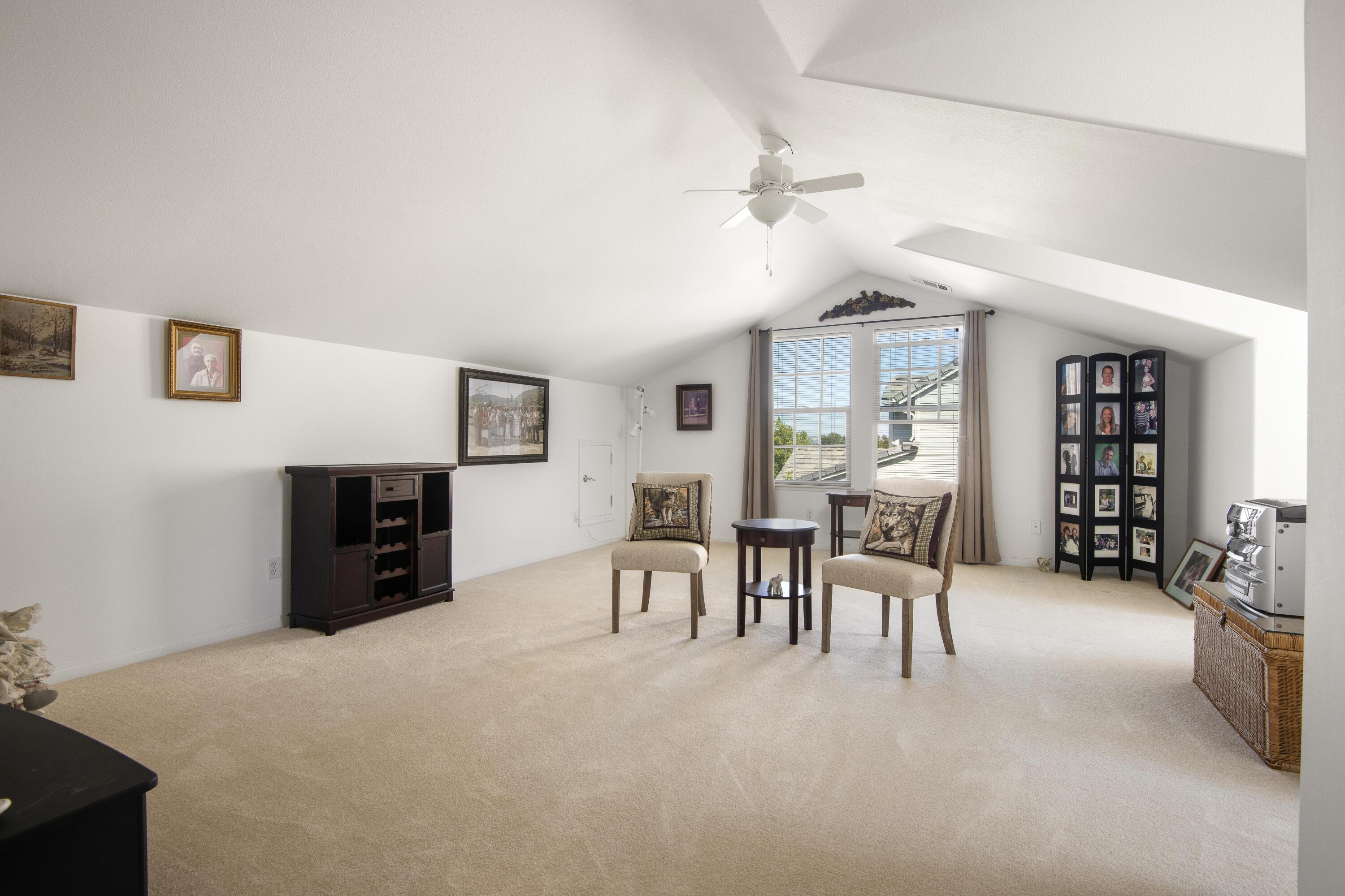 225 Silver Oak Drive Paso Robles, CA 93446 - Photo 15 of 22 a large white room with furniture and a flat screen tv