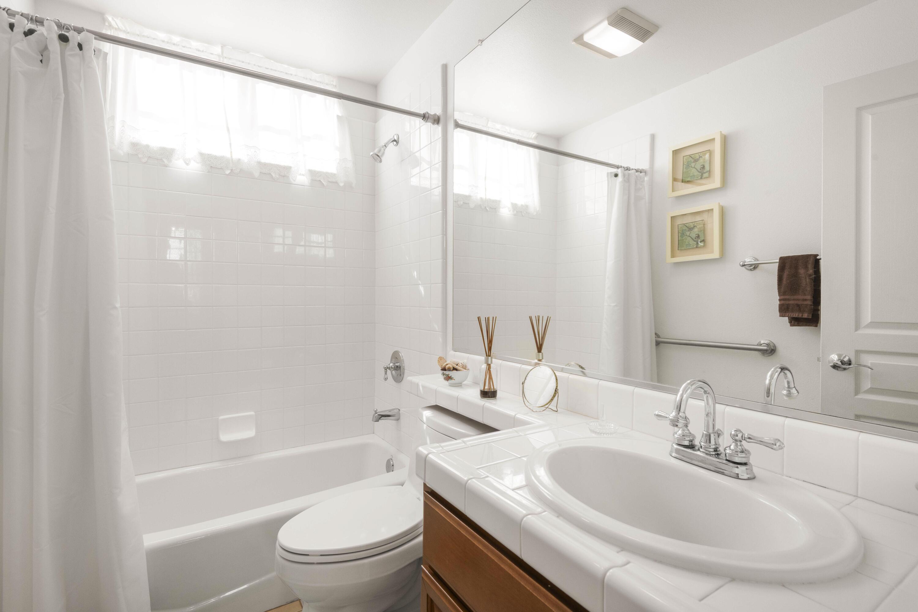 225 Silver Oak Drive Paso Robles, CA 93446 - Photo 16 of 22 a bathroom with a sink and a mirror