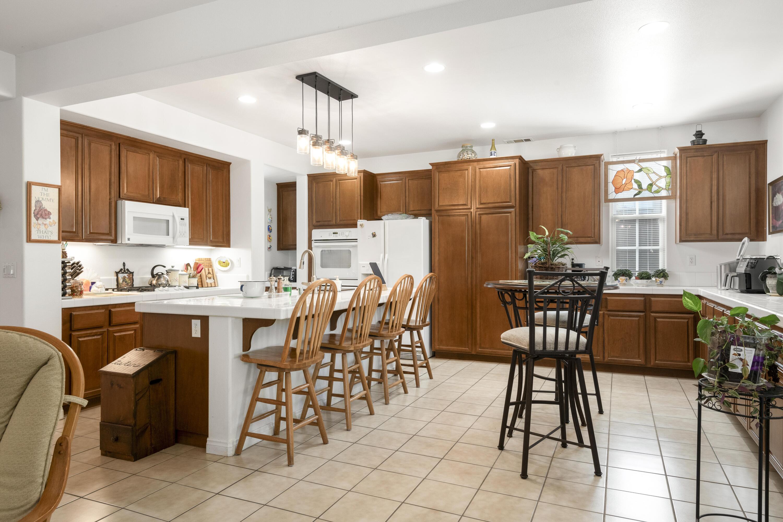 225 Silver Oak Drive Paso Robles, CA 93446 - Photo 3 of 22 a view of a dining room with furniture