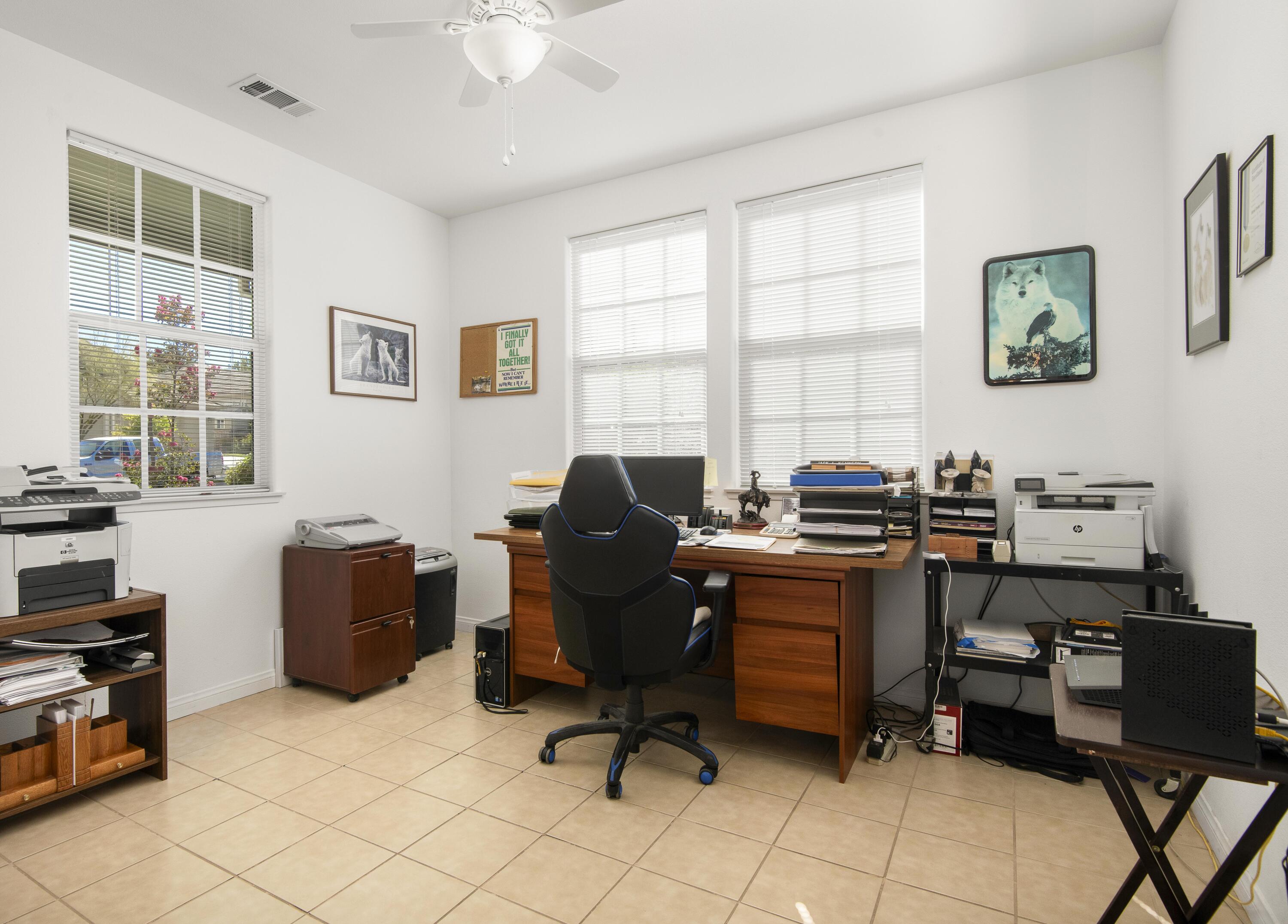 225 Silver Oak Drive Paso Robles, CA 93446 - Photo 6 of 22 a view of a workspace with furniture and a window