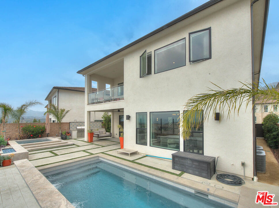20558 Overlook Court Porter Ranch, CA 91326 - Photo 38 of 48 a swimming pool with outdoor seating and yard