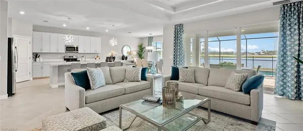 a view of a living room kitchen and a dining table with kitchen view