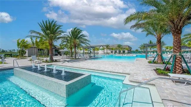 a view of a swimming pool and a patio