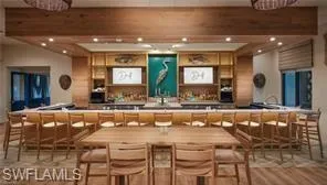 a outdoor space with lots of tables a chairs and kitchen view