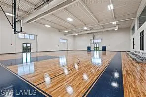 a indoor swimming pool with a table and chairs
