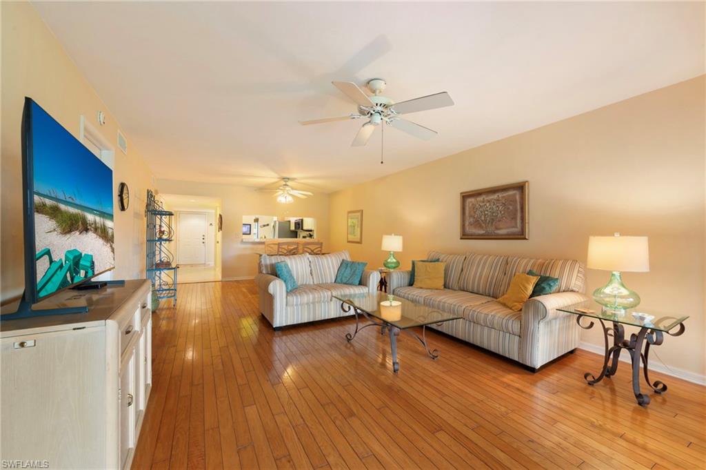 1231 Commonwealth Circle, Unit Q103 Naples, FL 34116 - Photo 11 of 22 Living-dining view from sliders