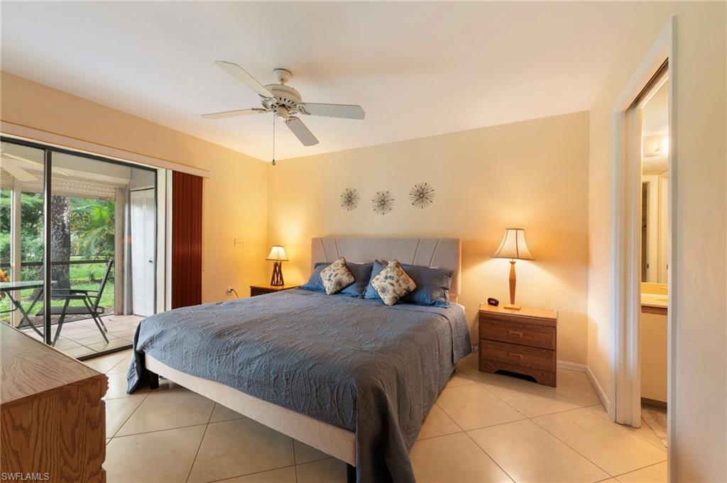 1231 Commonwealth Circle, Unit Q103 Naples, FL 34116 - Photo 17 of 22 Owner's bedroom with slider with en-suite bath