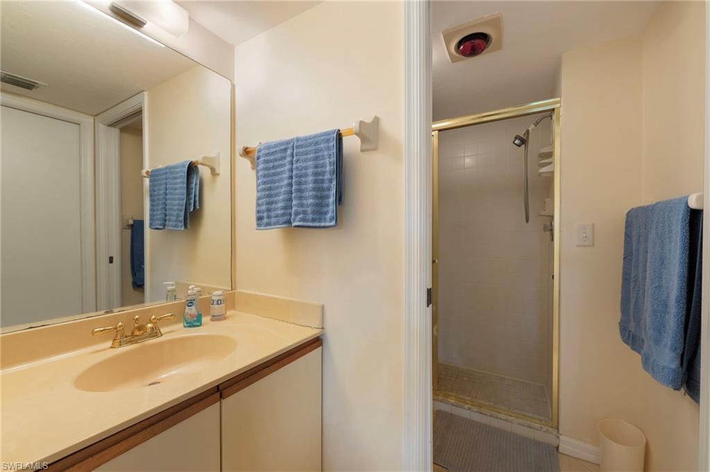 1231 Commonwealth Circle, Unit Q103 Naples, FL 34116 - Photo 18 of 22 Owner bath with private commode and shower area