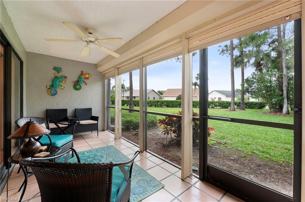 1231 Commonwealth Circle, Unit Q103 Naples, FL 34116 - Photo 19 of 22 Storm protected lanai with tile flooring is easy to maintain