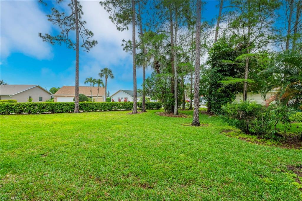 1231 Commonwealth Circle, Unit Q103 Naples, FL 34116 - Photo 21 of 22 Landscaped area behind