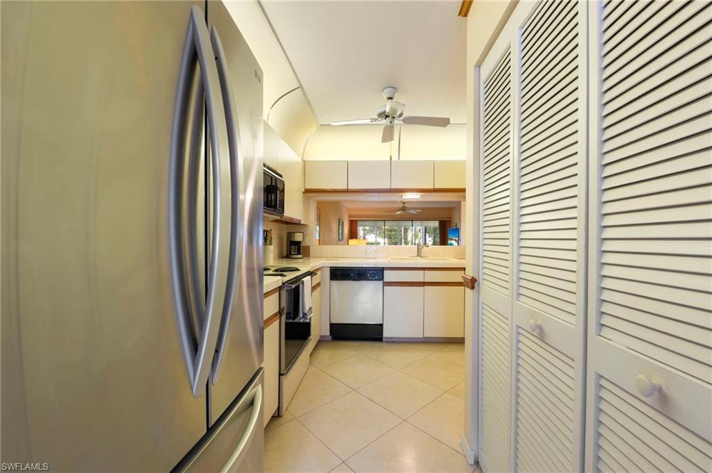 1231 Commonwealth Circle, Unit Q103 Naples, FL 34116 - Photo 7 of 22 Laundry closet in right in kitchen