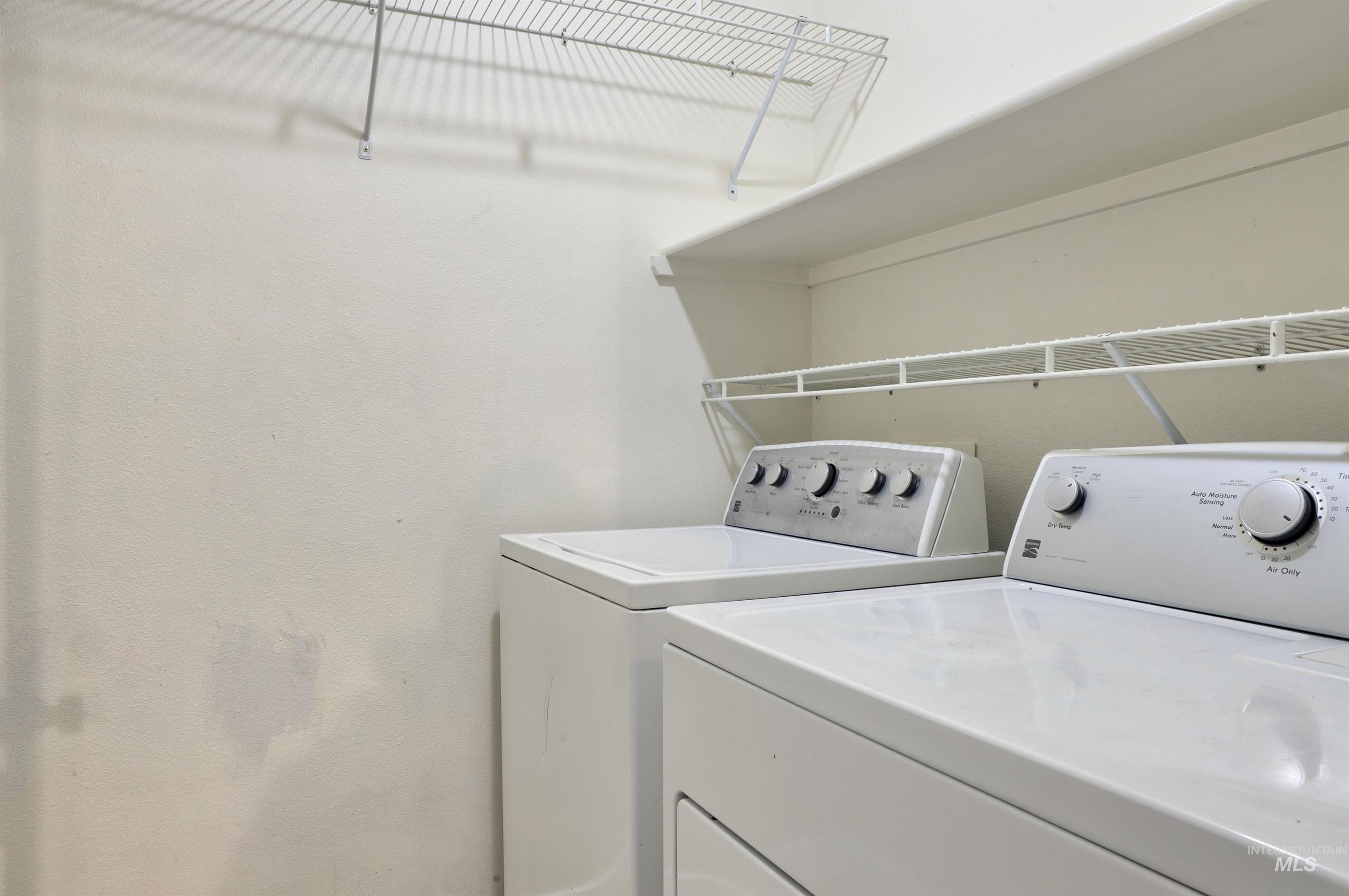4911 Buffalo Grass Avenue Caldwell, ID 83607 - Photo 11 of 15 Laundry room with washer and clothes dryer