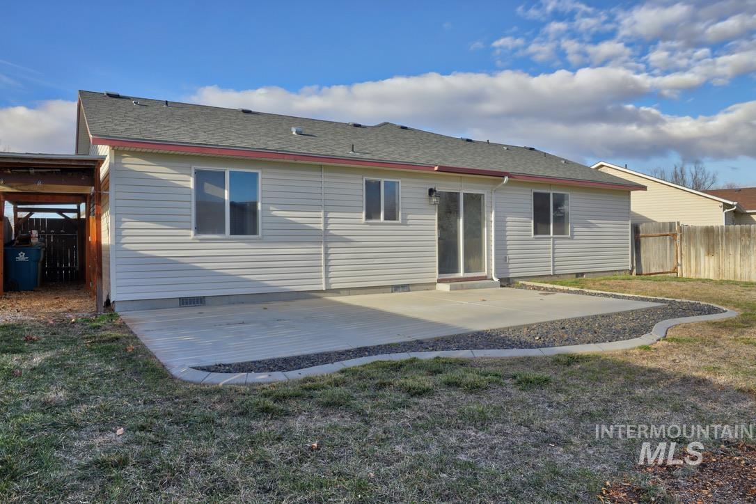 4911 Buffalo Grass Avenue Caldwell, ID 83607 - Photo 12 of 15 Rear view of property with crawl space, roof with shingles, and a patio