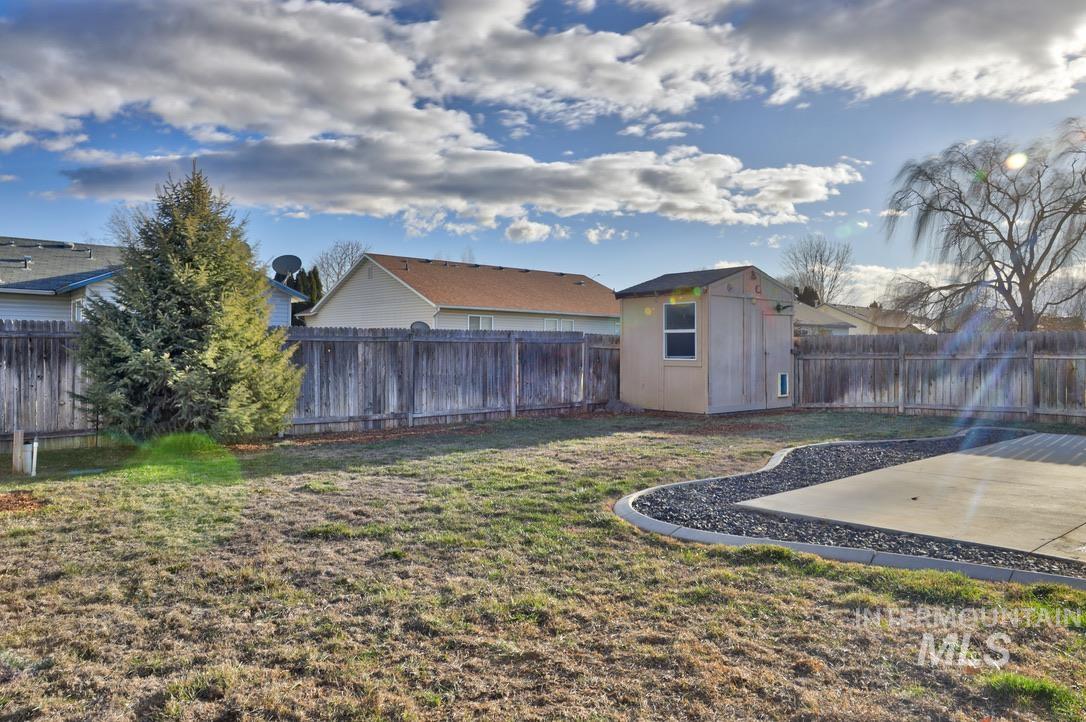 4911 Buffalo Grass Avenue Caldwell, ID 83607 - Photo 13 of 15 Fenced backyard featuring a storage shed