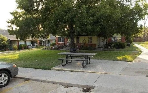 a swimming pool with outdoor seating and yard