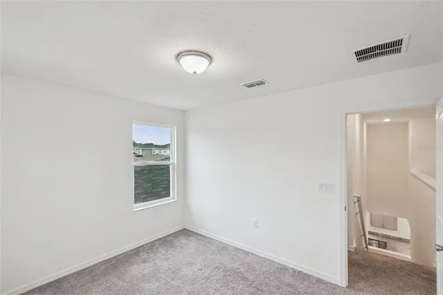 a bathroom with a granite countertop sink mirror and shower