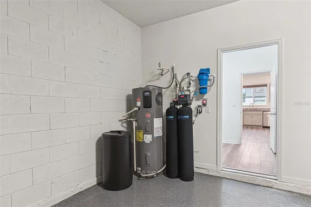 a view of a storage & utility room with a sink