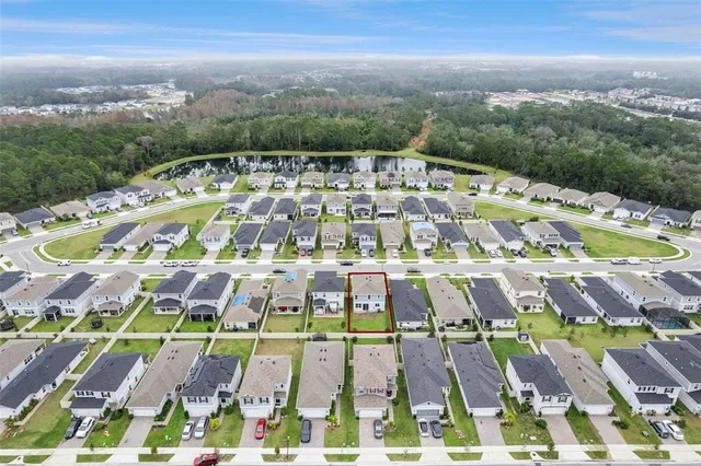 an aerial view of a house with a garden and plants
