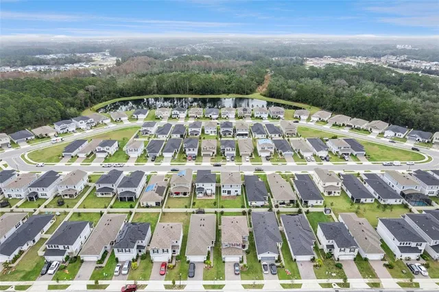 an aerial view of a house with a garden and plants