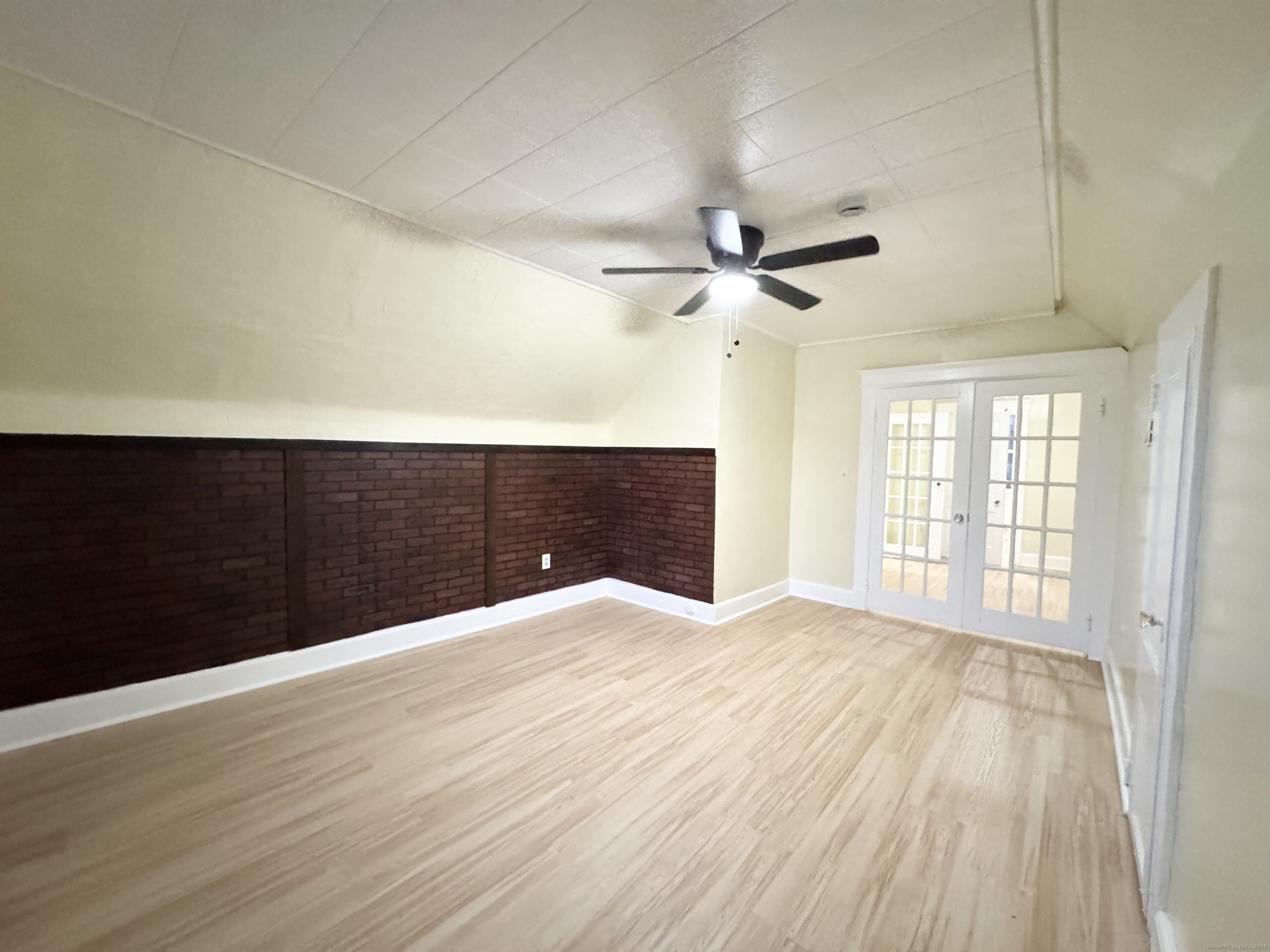 54 New Haven Avenue Waterbury, CT 06708 - Photo 4 of 9 a view of an empty room with a window