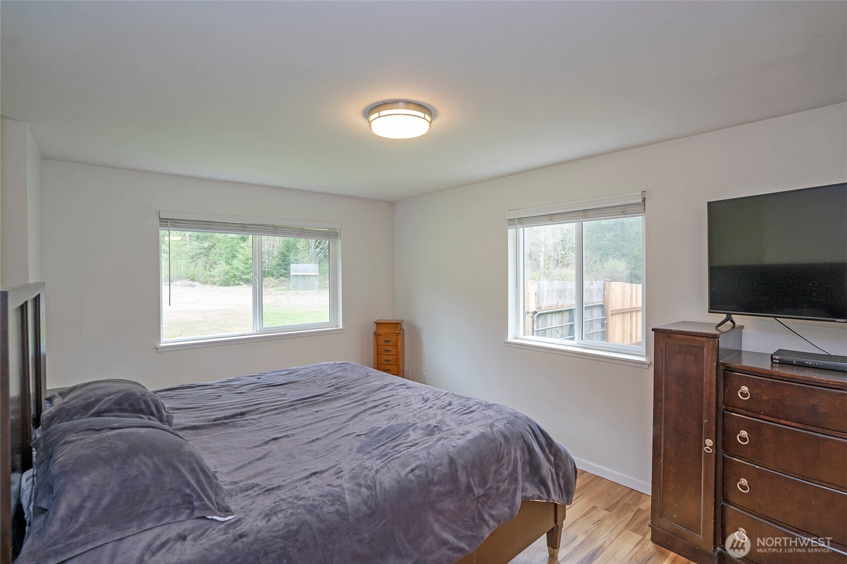 20108 Highway 706 Elbe, WA 98330 - Photo 13 of 37 a bedroom with a bed and a flat screen tv