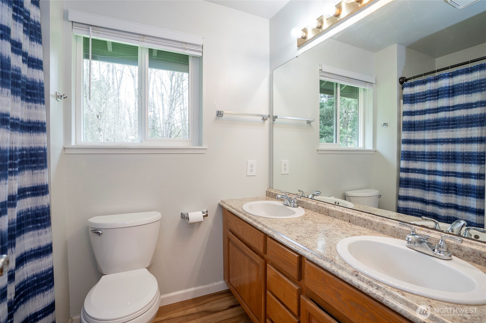 20108 Highway 706 Elbe, WA 98330 - Photo 15 of 37 a bathroom with a granite countertop toilet a sink and a large mirror