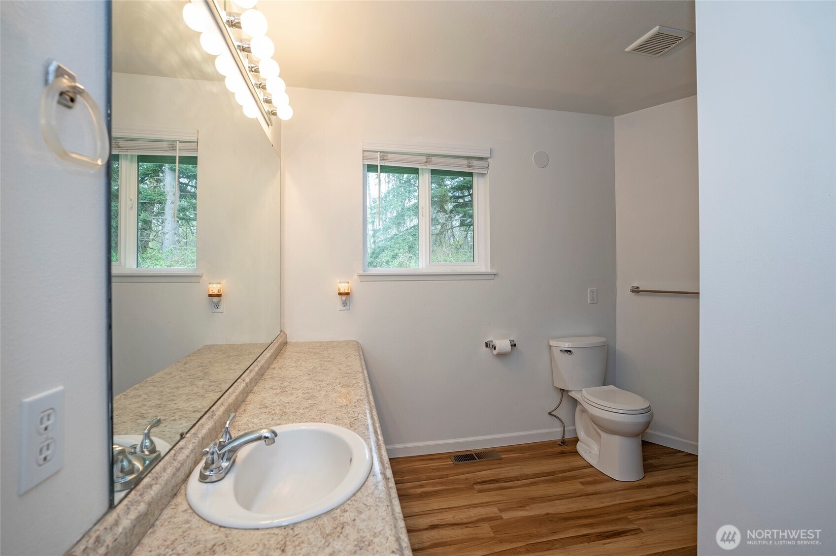 20108 Highway 706 Elbe, WA 98330 - Photo 19 of 37 a bathroom with a granite countertop sink a toilet and a window