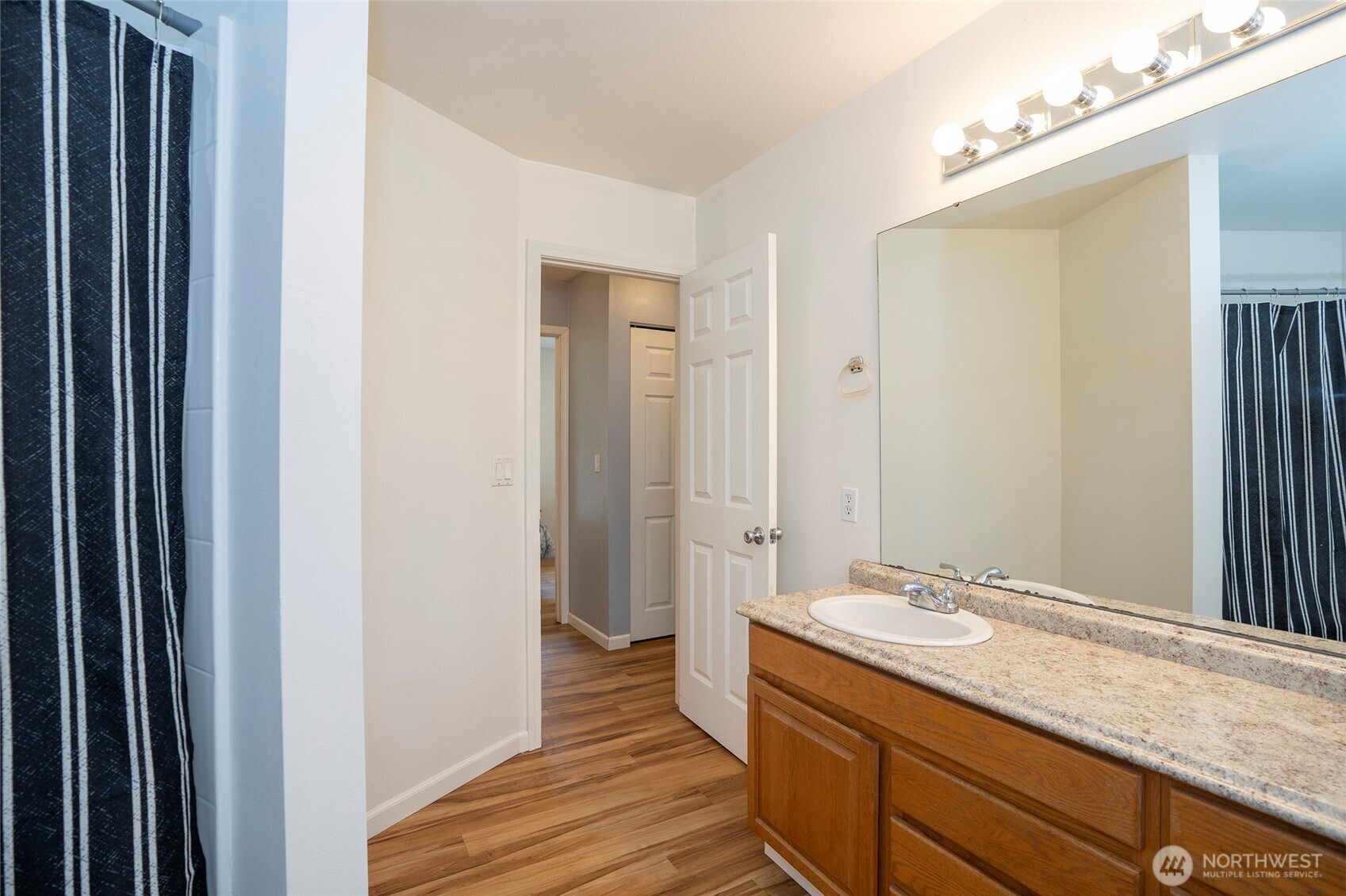 20108 Highway 706 Elbe, WA 98330 - Photo 20 of 37 a bathroom with a granite countertop sink and a mirror