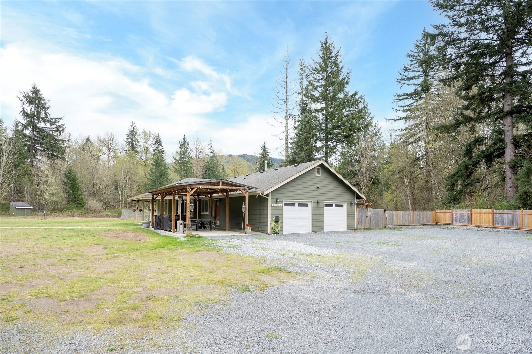 20108 Highway 706 Elbe, WA 98330 - Photo 3 of 37 a front view of a house with a yard and trees