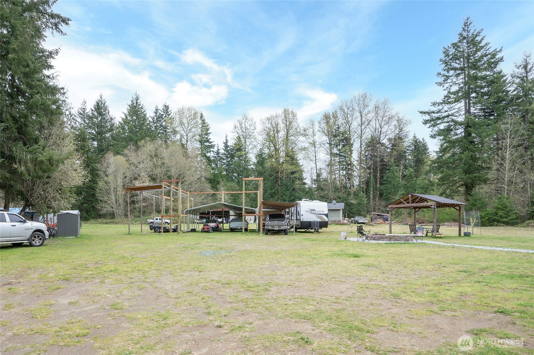 20108 Highway 706 Elbe, WA 98330 - Photo 34 of 37 a view of a house with swimming pool and sitting area