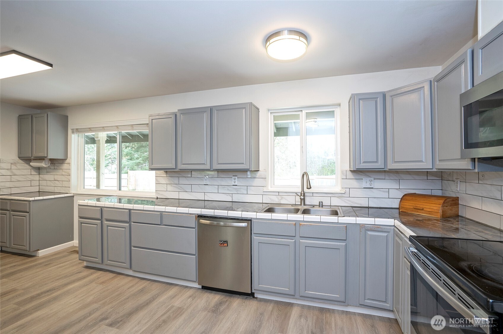 20108 Highway 706 Elbe, WA 98330 - Photo 8 of 37 a kitchen with a sink stove and cabinets