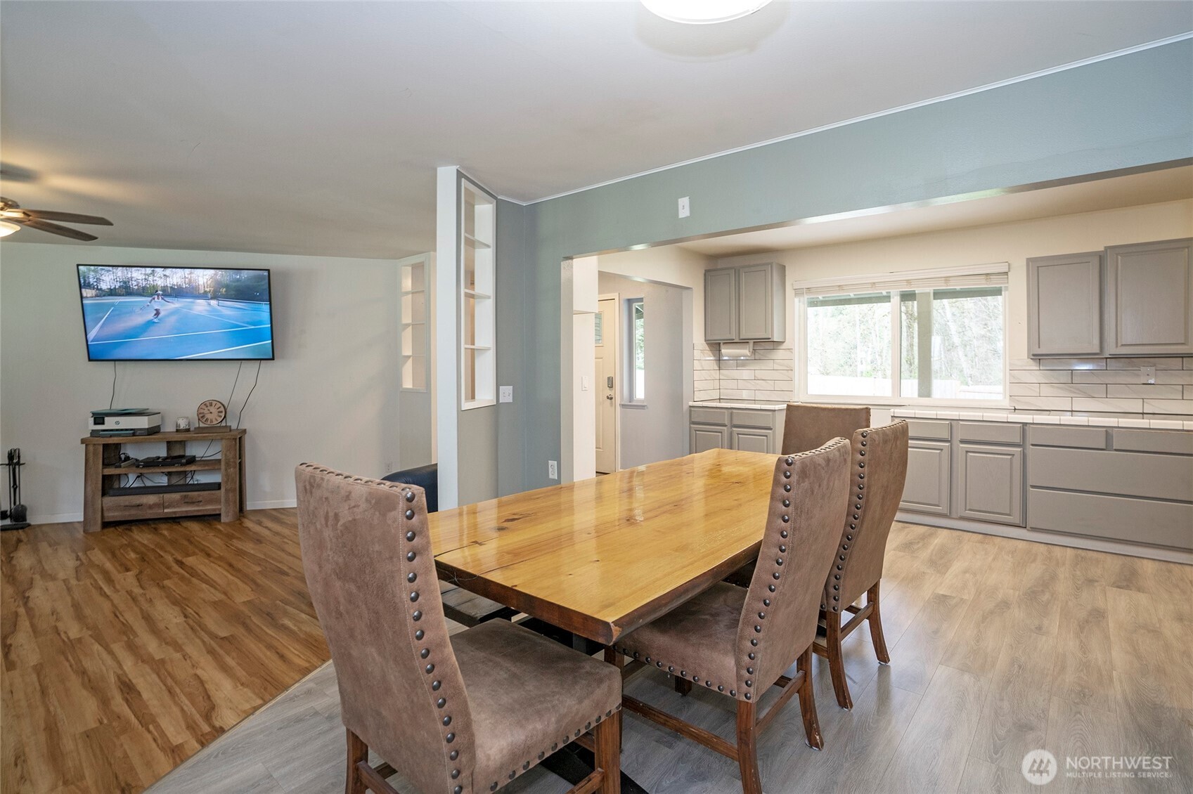 20108 Highway 706 Elbe, WA 98330 - Photo 10 of 37 a view of a dining room with furniture and wooden floor