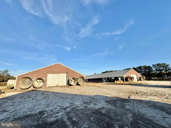a view of a street with a building in the background