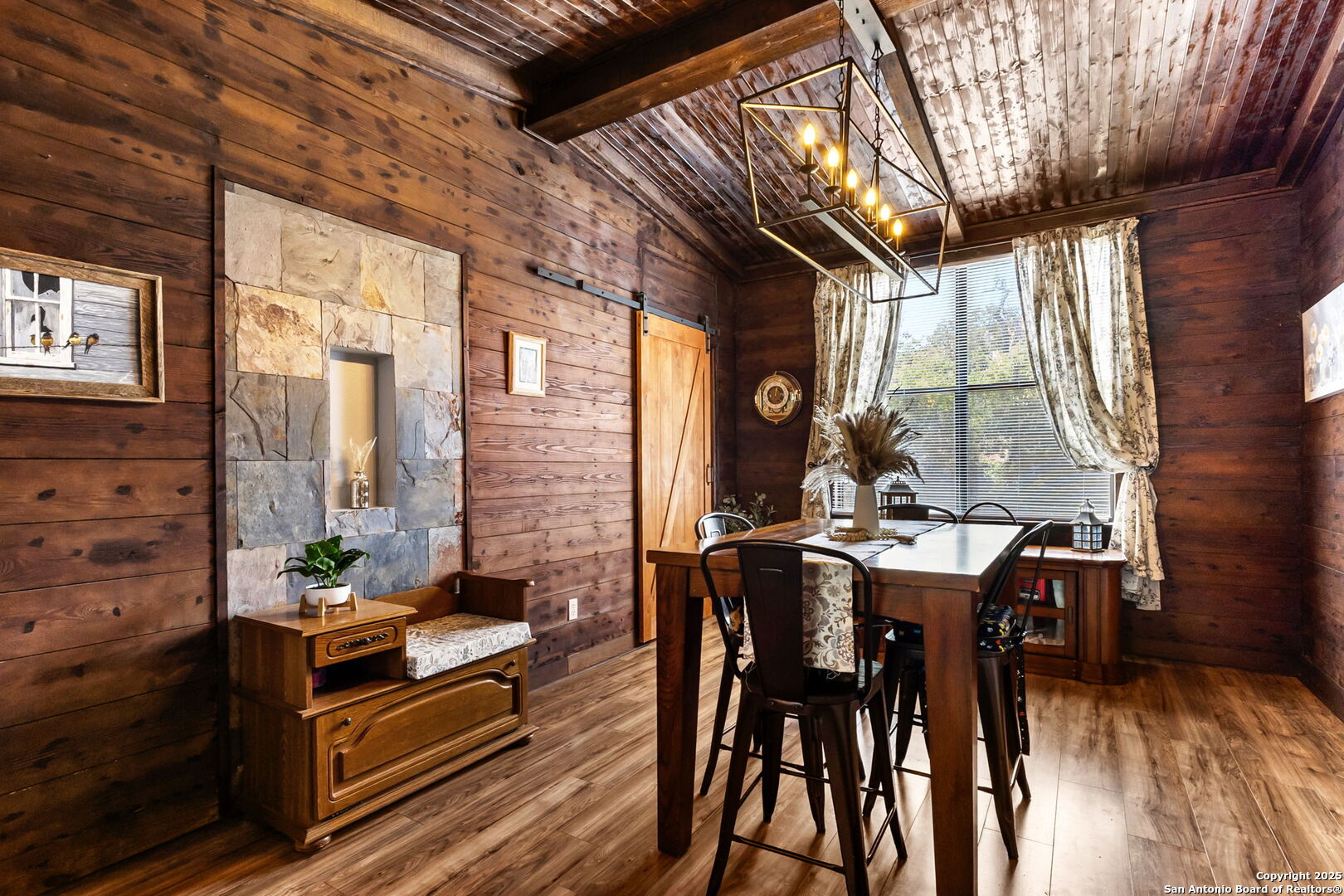 114 Avenue B Converse, TX 78109 - Photo 16 of 26 a dining room with furniture a floor to ceiling window and potted plants