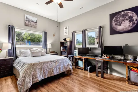 a bathroom with a sink a toilet and shower curtain
