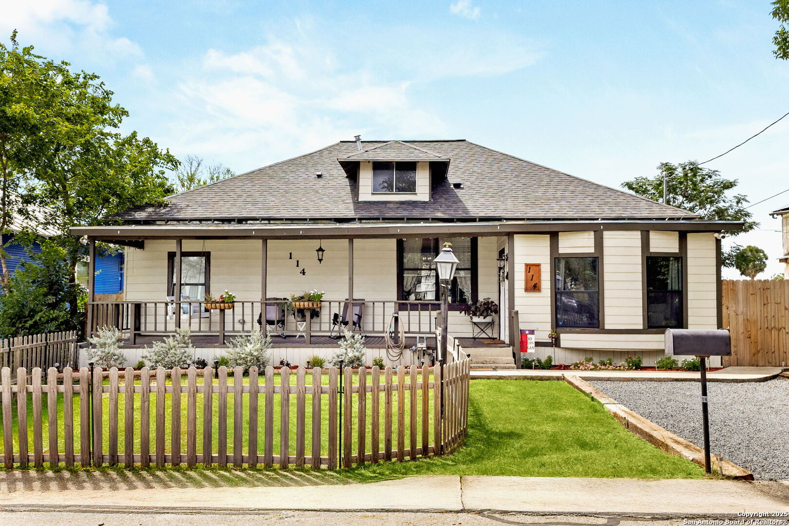 114 Avenue B Converse, TX 78109 - Photo 2 of 26 a front view of house with a yard and potted plants