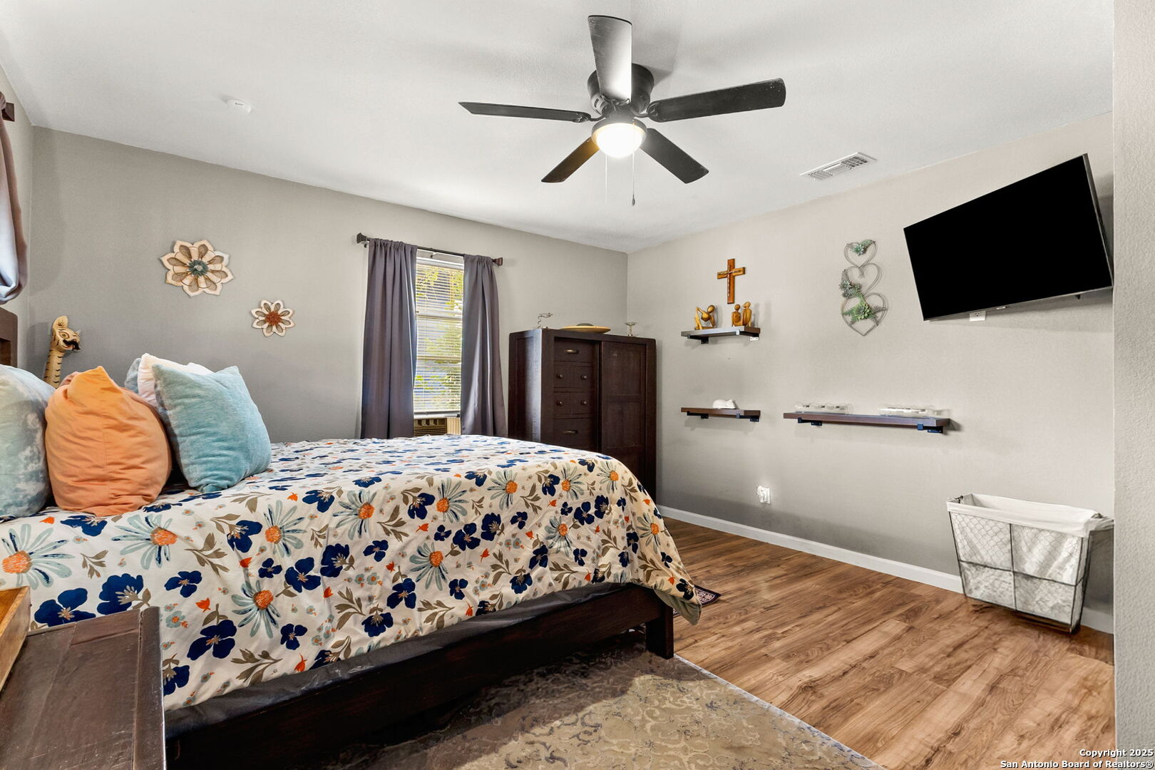 114 Avenue B Converse, TX 78109 - Photo 22 of 26 a bedroom with a bed and a flat screen tv