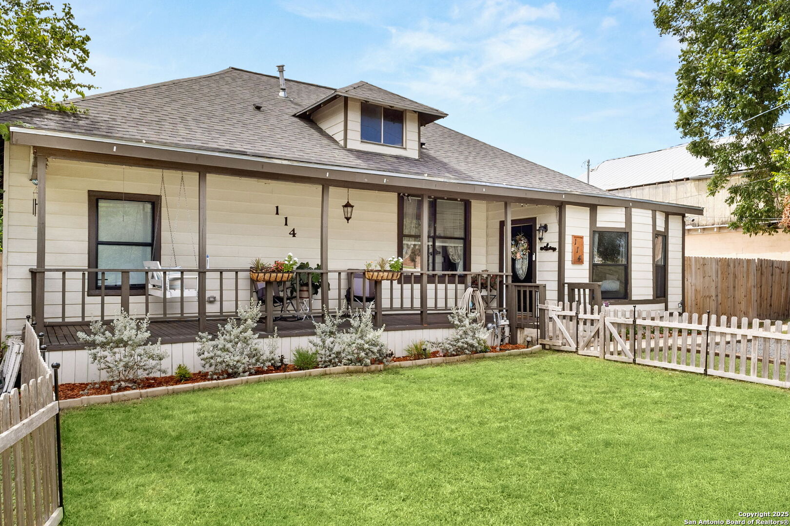 114 Avenue B Converse, TX 78109 - Photo 3 of 26 a front view of house with a garden