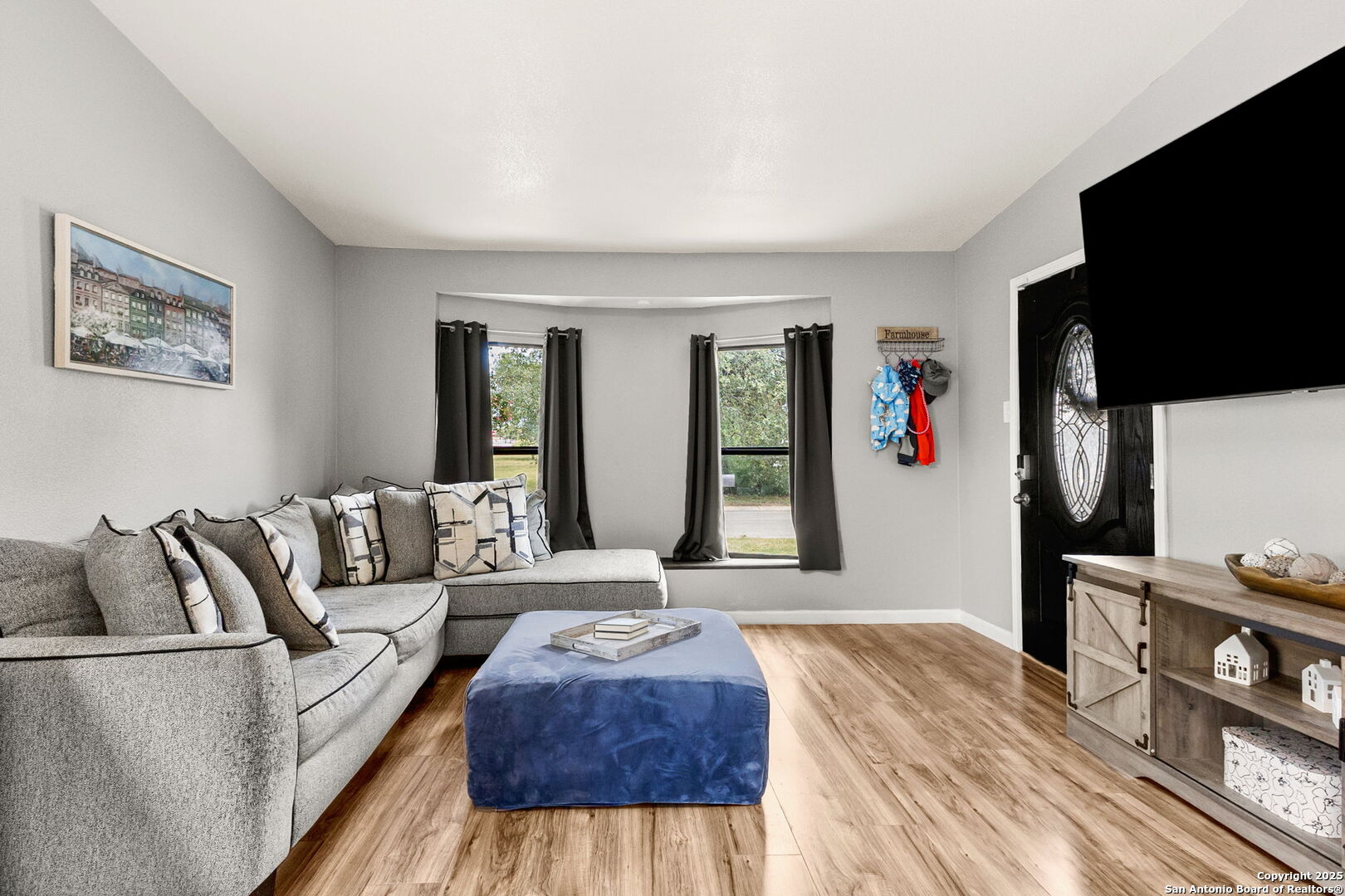 114 Avenue B Converse, TX 78109 - Photo 7 of 26 a living room with furniture and a flat screen tv