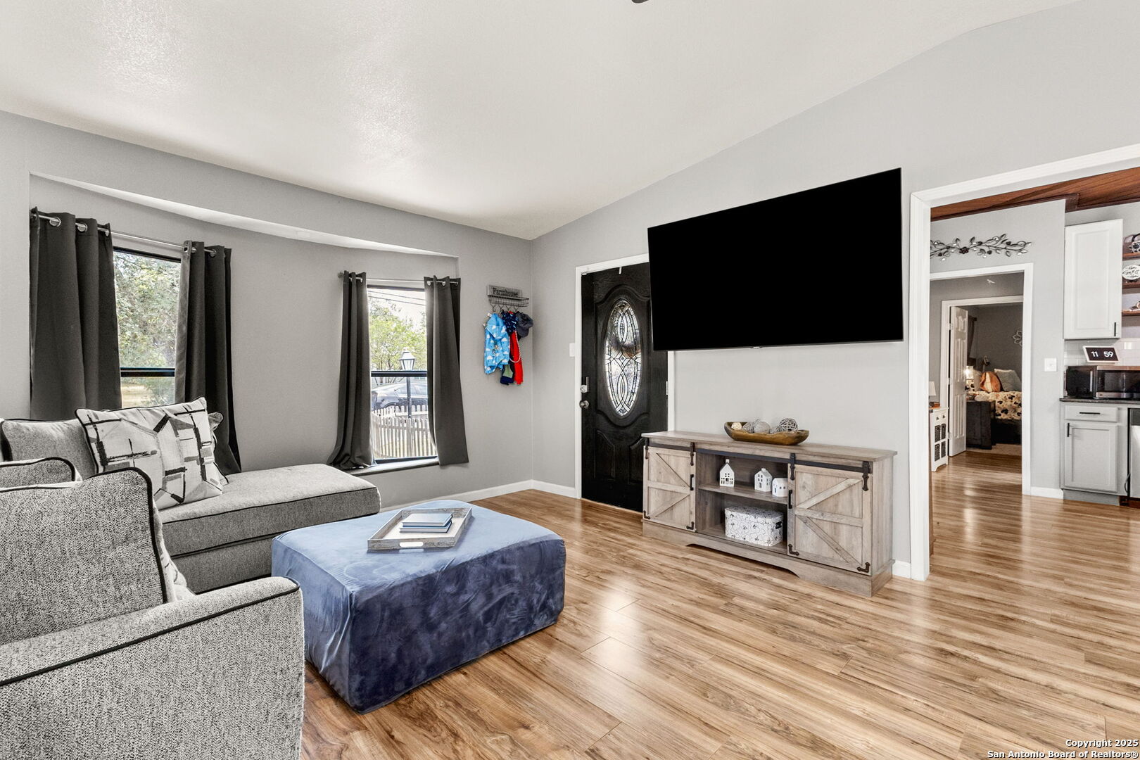 114 Avenue B Converse, TX 78109 - Photo 9 of 26 a living room with furniture and a flat screen tv
