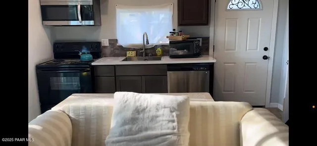 a bedroom with a bed and a fireplace